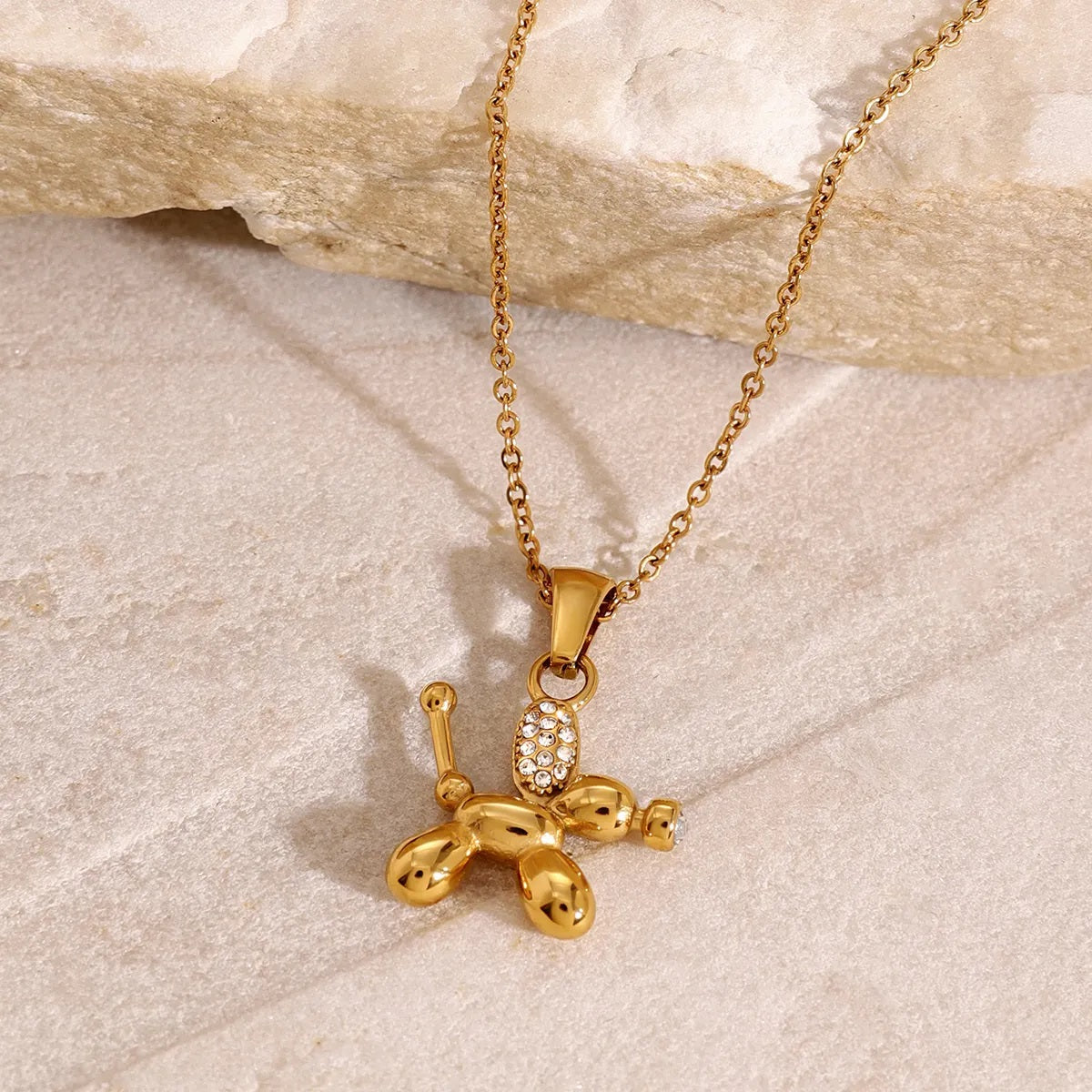 Zirconia-studded balloon dog pendant featuring a sparkling balloon dog shape, crafted from anti-tarnish and waterproof stainless steel, ideal for dog moms.