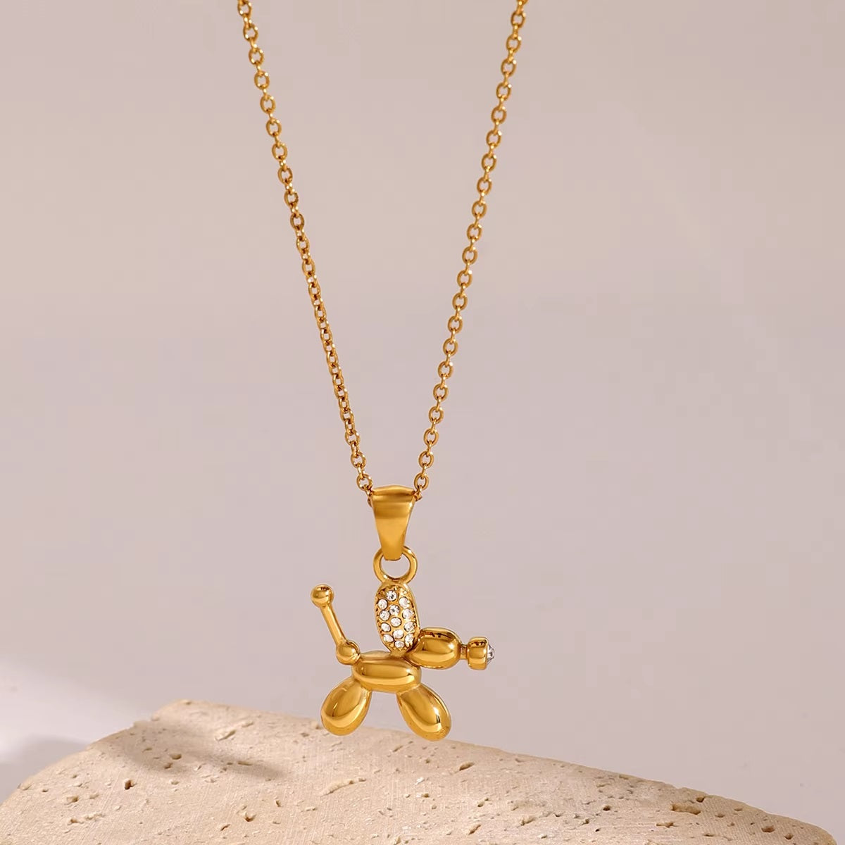 Zirconia-studded balloon dog pendant featuring a sparkling balloon dog shape, crafted from anti-tarnish and waterproof stainless steel, ideal for dog moms.